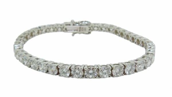 14K White gold lab grown diamond tennis bracelet claw set with forty-two round brilliant cut lab grown diamonds, 10.25 total carat weight, F/G/H, VS2-SI1. Available in 14K gold, 18K gold, or platinum. This bracelet can be made in any combination of white, pink or yellow gold and can be customized to accommodate different size and shape diamonds, by special order.