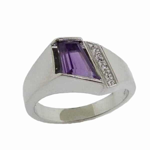 14K White gold lady's ring channel set with 0.93 carat custom cut amethyst and accented with 6 pave set round brilliant cut diamonds totaling 0.03 carats, G-H, SI1-2. See our in stock selection of amethyst jewellery here. Available in 14K gold, 18K gold, or platinum. This ring can be made in any combination of white, pink or yellow gold and can be customized to accommodate different size and shape diamonds, by special order.