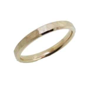 14K Yellow gold 4mm beveled edge band with hammered stainless centre and polished edges.  Available in 14K gold, 18K gold, or platinum. This ring can be made in any combination of white, pink or yellow gold and can be customized to different widths and finishes by special order.