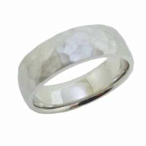 14K White gold 7mm wide domed men's band with a hammered texture and a stainless finish.  Available in 14K gold, 18K gold, or platinum. This ring can be made in any combination of white, pink or yellow gold and can be customized to different widths and finishes by special order.
