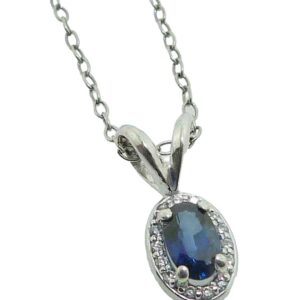 14K White gold halo pendant claw set in the centre with a 0.26 carat oval blue sapphire and in the halo with 0.04 total carat weight, H/I, SI2-I1.