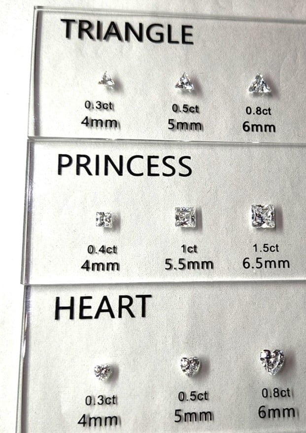 A picture showing the differences between triangle, princess, and heart shaped diamonds. These are not popular diamond shapes.