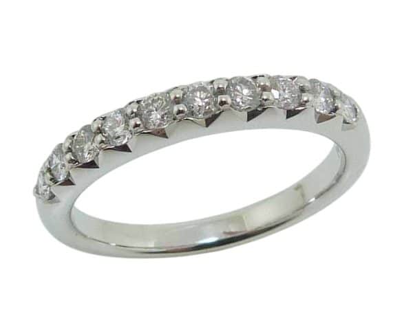 14K White gold lady's diamond band claw set with ten very good cut, natural round brilliant cut diamonds, 0.447 total carat weight, G/H, SI1-2. We set natural, mined diamonds in this band but priced it at lab grown diamond prices!