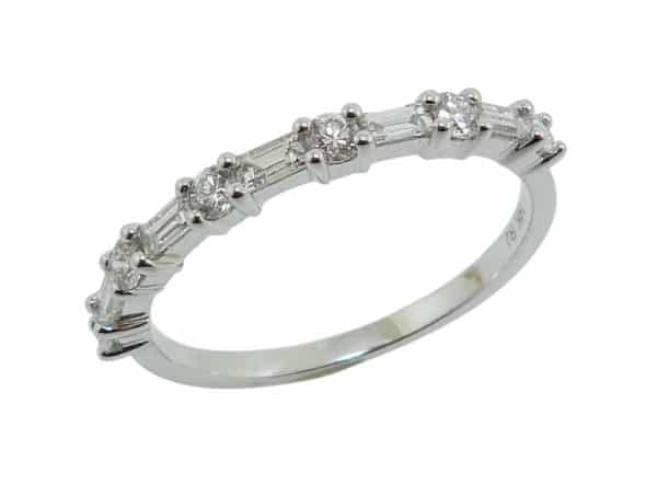 14K White gold diamond wedding band claw set with 5 baguette diamonds, 0.20 total carat weight, and six round brilliant cut diamonds, 0.23 total carat weight.