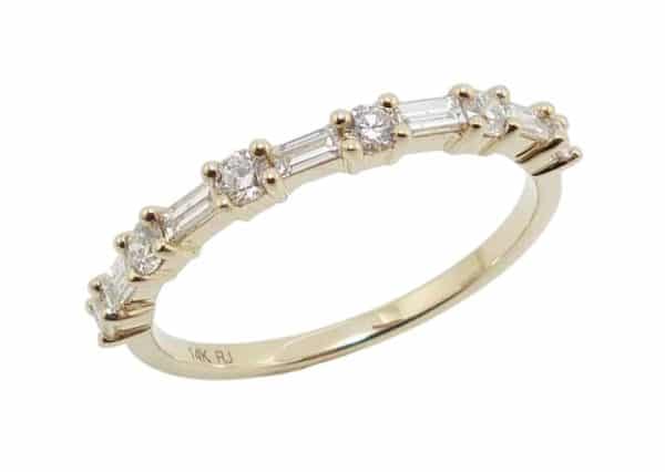 14K Yellow gold diamond lady's band claw set with five baguette diamonds, 0.20 total carat weight, and six round brilliant cut diamonds 0.23 total carat weight.