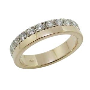 14K Yellow gold lady's band claw set on one side with twelve round brilliant cut natural diamonds, totaling 0.504 carats, G-H, SI.