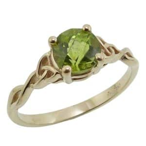 14K Yellow lady's Celtic knot ring claw set with a 1.23 carat peridot.
