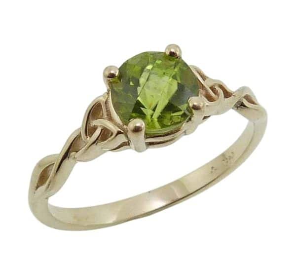 14K Yellow lady's Celtic knot ring claw set with a 1.23 carat peridot.