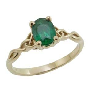 14K Yellow gold lady's Celtic knot ring claw set with a 0.779 carat emerald.