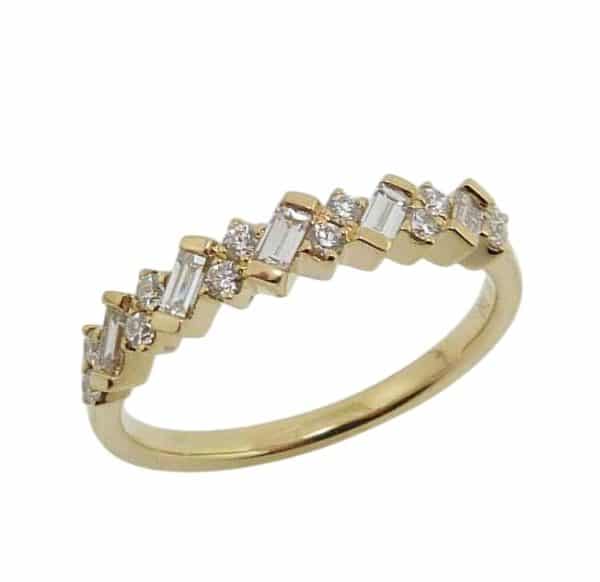 18K Yellow gold diamond band claw set with baguettes and round brilliant cut diamonds, 0.34 total carat weight, G/H, SI.