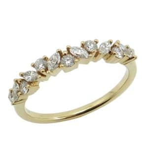 18K Yellow gold lady's band claw set with marquise and round brilliant cut diamonds, 0.40 total carat weight.