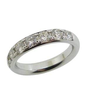 14K White gold lady's band claw set with seven natural round brilliant cut diamond's, 1.025 total carat weight, G/H, SI1-2.