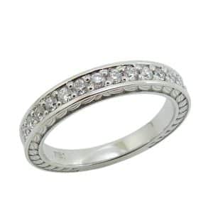 Platinum engraved lady's wedding band pave set with thirteen natural round brilliant cut diamonds, 0.274 total carat weight, E/F, VS+.