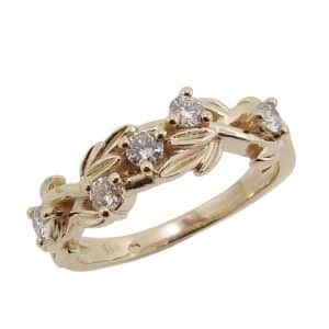 14K Yellow gold diamond lady's leaf and vine band claw set with five natural, round brilliant cut diamonds, 0.291 total carat weight, H/I, SI.
