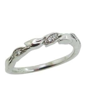 14K White gold lady's band pave set with six very good cut, natural round brilliant cut diamonds, 0.055 total carat weight, SI.