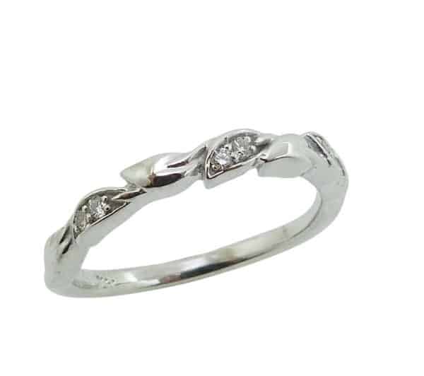 14K White gold lady's band pave set with six very good cut, natural round brilliant cut diamonds, 0.055 total carat weight, SI.
