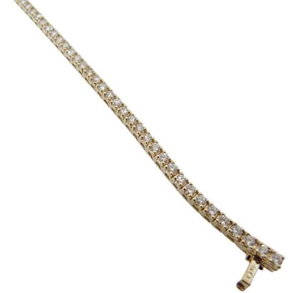 14K Yellow gold diamond tennis bracelet claw set with fifty-two very good cut, natural round brilliant cut diamonds, 4.38 total carat weight, H/I, SI1-2.