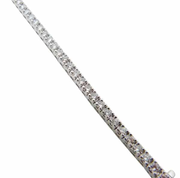 14K White gold tennis bracelet claw set with fifty natural, round brilliant cut diamonds, 5.375cttw H/I, SI1-2.