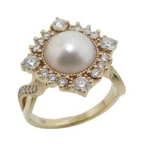 14K Yellow gold custom lady's ring by Studio Tzela set in the centre with a Mabe pearl and accented in the halo with thirty-eight lab grown diamonds, 0.77 total carat weight, F/G, VS+.