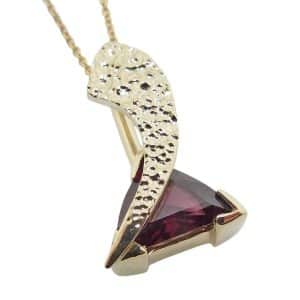 14K Yellow gold custom pendant by Studio Tzela V tip set with a trillion cut rhodolite garnet, 2.472 carats. 