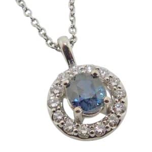 14K White gold halo pendant claw set in the centre with 1.407ct bi-colour Montana sapphire and accented in the halo with fourteen natural, very good cut round brilliant cut diamonds, 0.465 total carat weight, G/H, SI1-2.