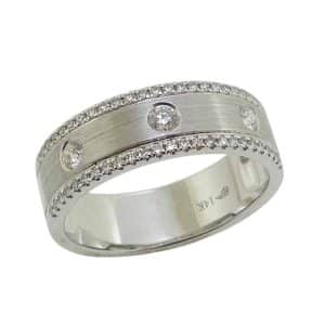 14K White gold dual finish flush and pave set lady's band with fifty-three round brilliant cut diamonds, 0.28 total carat weight.
