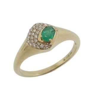 14K Yellow gold reverse taper ring pave set with an oval emerald, 0.16 carat, and twenty-eight round brilliant cut diamonds, 0.11 total carat weight.