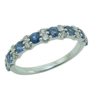 14K White gold blue sapphire and diamond band claw set with fourteen round brilliant cut diamonds, 0.33 total carat weight, alternating with eight blue sapphires, 0.75 total carat weight.
