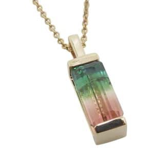 14K Yellow gold Studio Tzela pendant channel set with a 1.198 carat watermelon tourmaline.