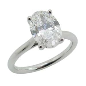 14K White gold cathedral style engagement ring claw set with a 2.03 carat, D, VVS2, oval brilliant cut lab grown diamond.