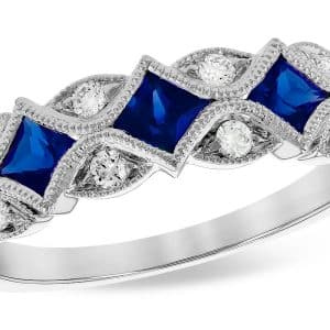 14K White gold vintage style sapphire and diamond lady's band with milgrain details bezel set with three blue sapphires, 0.55 total carat weight, and bead set with natural round brilliant cut diamonds, 0.15 total carat weight, G/H, SI1+.