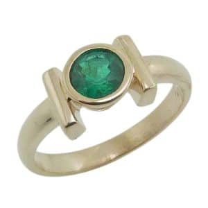 14K Yellow gold 0.565 carat bezel set emerald lady's ring.