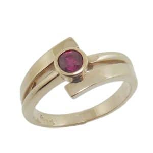 14K Yellow gold bezel set 0.40 carat ruby lady's ring.