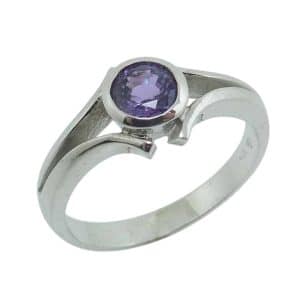 14K White gold bezel set purple sapphire lady's ring, 0.651 carat.