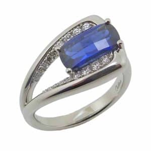 14K White gold lady's ring claw set with a Chatham checkerboard cushion blue sapphire, 2.08 carat, and accented with pave set lab grown diamonds, 0.23 total carat weight.