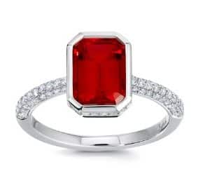 14K White gold lady's ring bezel set with a 2.32 carat octagonal Chatham ruby and accented on the band and in the hidden halo with pave set round brilliant cut lab grown  diamonds, 0.48 total carat weight.
