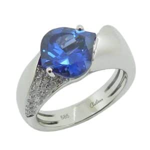 14K White gold Chatham lady's ring claw set with an onion cut lab grown blue sapphire, 3.1 carat and accented with pave set lab grown diamonds, 0.30 total carat weight.