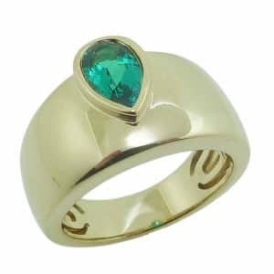 14K Yellow gold Chatham lady's ring bezel set with a 0.80 carat pear shape lab grown emerald.