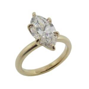 14K Yellow gold tulip prong solitaire engagement ring claw set with a 1.77 carat, D, VVS2 marquise brilliant cut lab grown diamond.