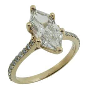 14K Yellow gold engagement ring claw set with a 2.24 carat, E, VVS1 hexagonal modified brilliant cut (Dutch marquise) lab grown diamond, accented on the band with twenty-two claw set round briliant cut lab grown diamond's, 0.33cttw, E/F, VS+.