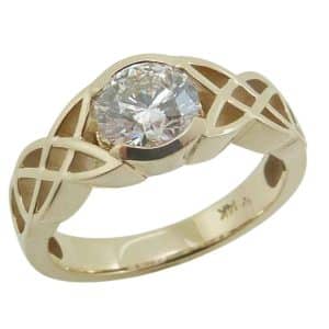 14K Yellow gold celtic solitaire engagement ring claw set with a 1.05 carat, D, VVS2 round brilliant cut lab grown diamond.
