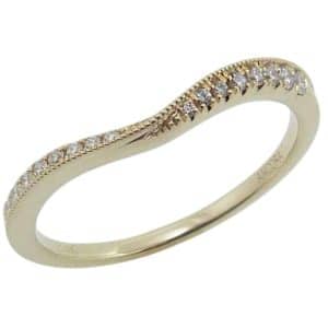 14K Yellow gold twisted milgrain accented curved lady's wedding band pave set with sixteen round brilliant cut natural diamonds, 0.12cttw.