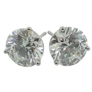 14K White gold three prong round brilliant cut  lab grown diamond martini studs with locking backs set with 3.08 carat, D, VVS2, and a 3.07 carat, D, VVS2.