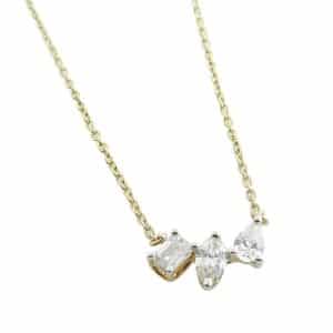 14K Yellow gold diamond necklace claw set with one emerald cut diamond, 0.15 carat; one pear brilliant cut diamond, 0.16 carat; one marquise brilliant cut diamond, 0.16 carat. This is a DISCONTINUED ITEM.