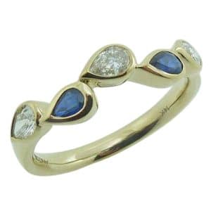 14K Yellow gold lady's bezel set band with two pear shape blue sapphires, 0.32cttw, and three pear shape diamonds, 0.34cttw.