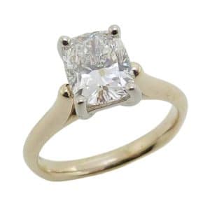 14K Yellow and white gold cathedral stirrup shank engagement ring claw set with a 1.62 carat D, VS1 elongated cushion brilliant cut lab grown diamond.