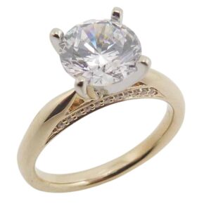 14K Yellow and white gold solitaire engagement ring set in the centre with a 2 carat round CZ and accented in the bridge with pave set round brilliant cut diamonds, 0.08cttw.