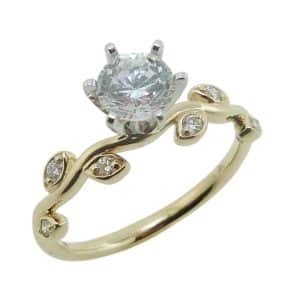 14K Yellow and white gold leaf accented solitaire engagement ring claw set in the centre with a 1 carat round CZ and six round brilliant cut diamonds, 0.12cttw.
