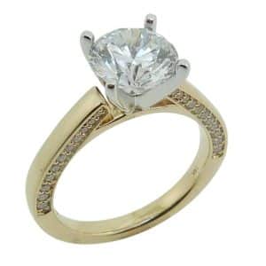 14K Yellow and white gold solitaire engagement claw set in the centre with a 2.0 carat round CZ and pave set in the profile with 0.28 total carat weight round brilliant cut diamonds.