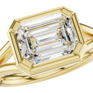 14K Yellow gold Allison Kaufman split shank solitaire engagement ring east-west orientation claw set bezel with a 3 carat emerald cut CZ.